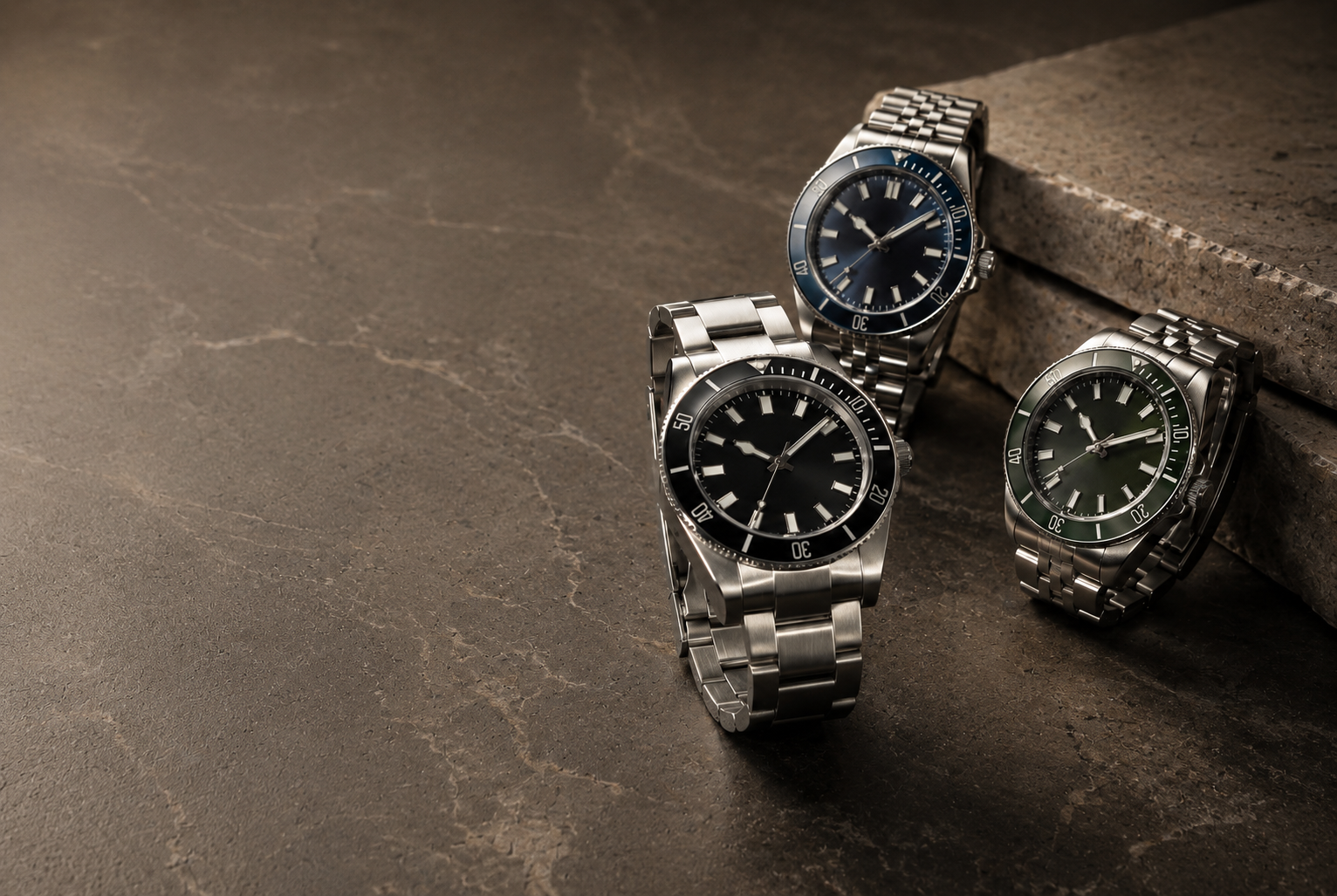 Rolex Submariner, Datejust and Daytona watches on stone at the InstaGold 47th Street office
